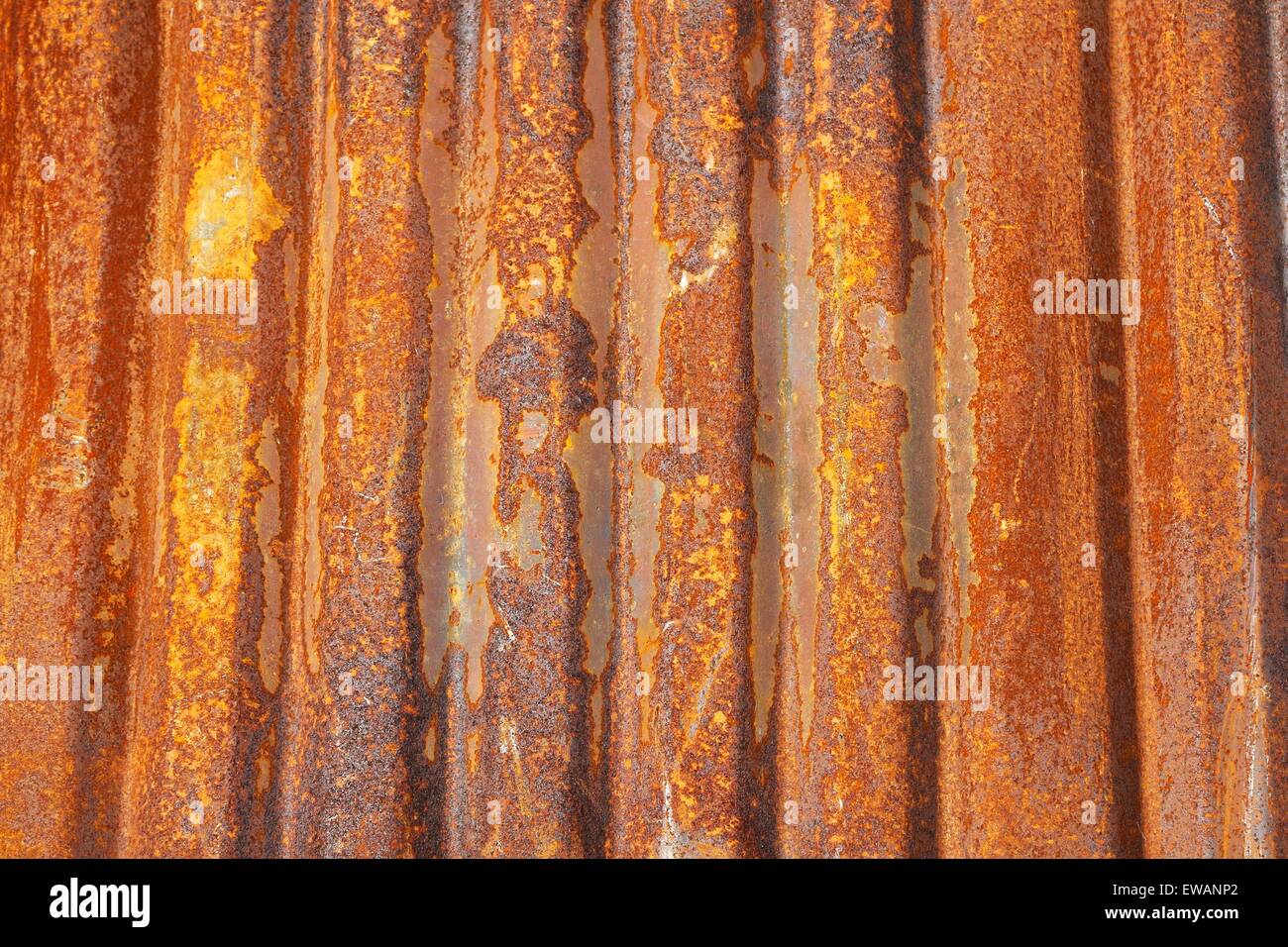 Old corrugated metal sheet covered with rust Stock Photo