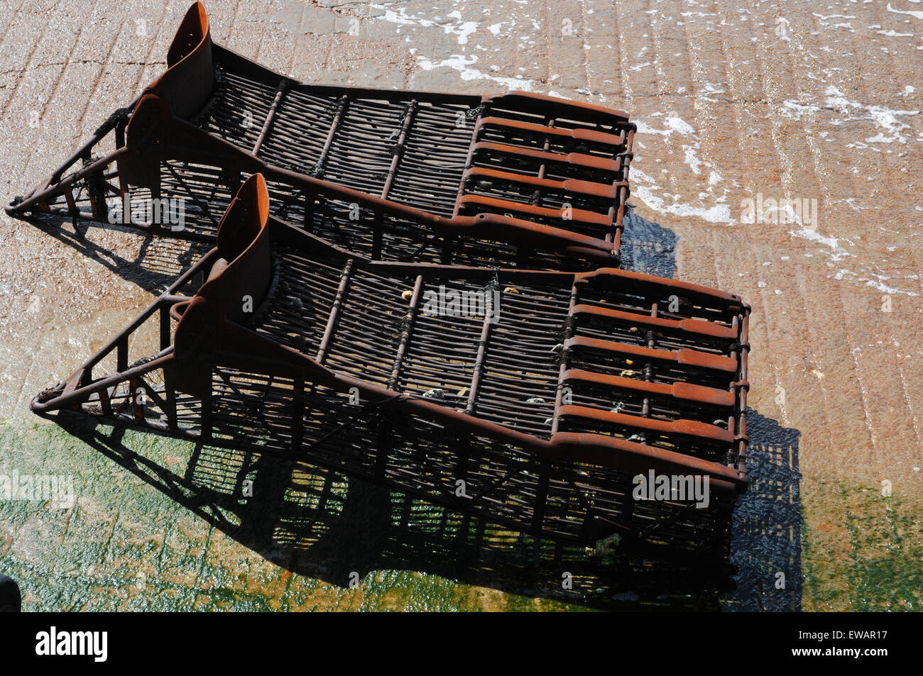 Two clam dredges at the water's edge in the Brittany port of St Malo