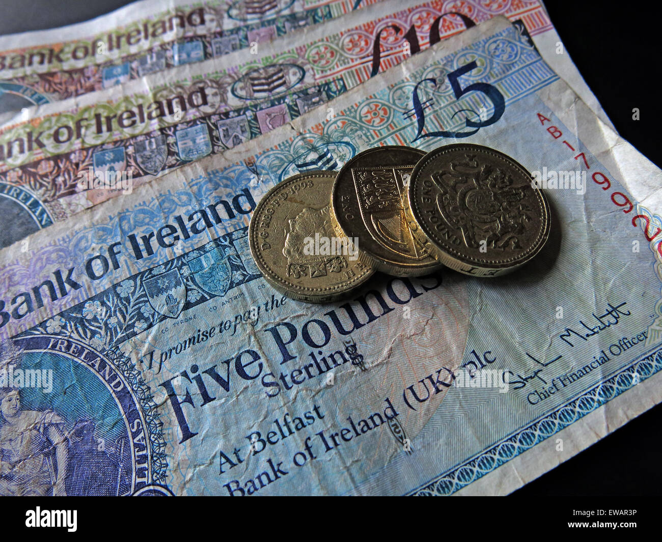 Northern Irish £5, £10 notes and pound coins, legal tender from the Bank Of Ireland , Belfast Stock Photo