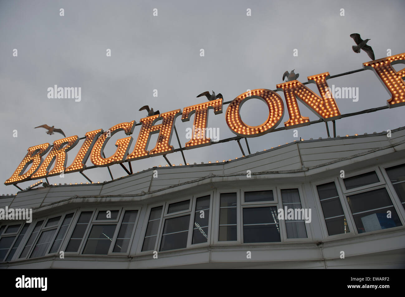 Brighton Pier Light on a dark cloudy day Stock Photo