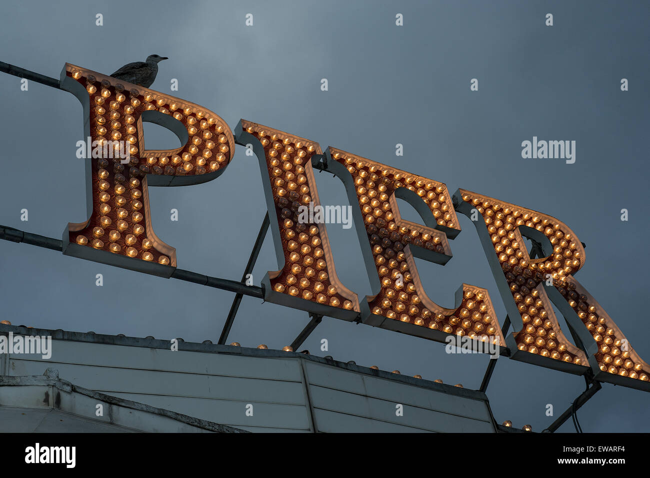 Brighton Pier Light on a dark cloudy day Stock Photo