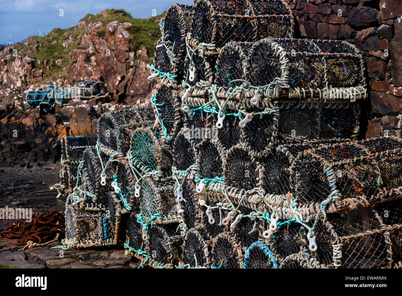 A pile of obster pots stored on the stone jetty at Croig, Isle of Mull, Inner Hebrides, Argyll, Scotland Stock Photo