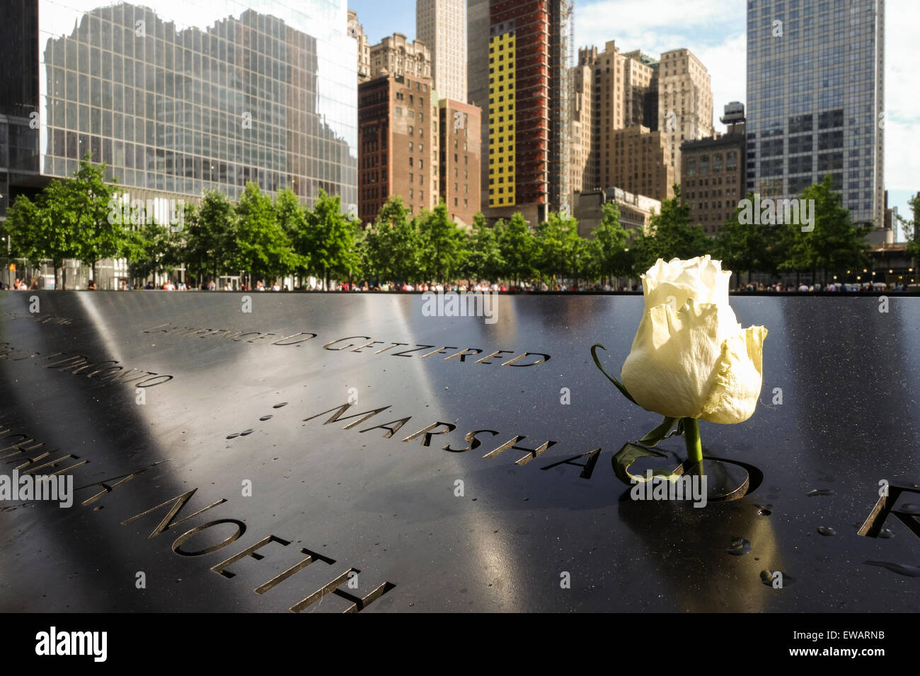Names engraved in bronze plates with rose at National September 11 Memorial & Museum, New york city, USA. Stock Photo