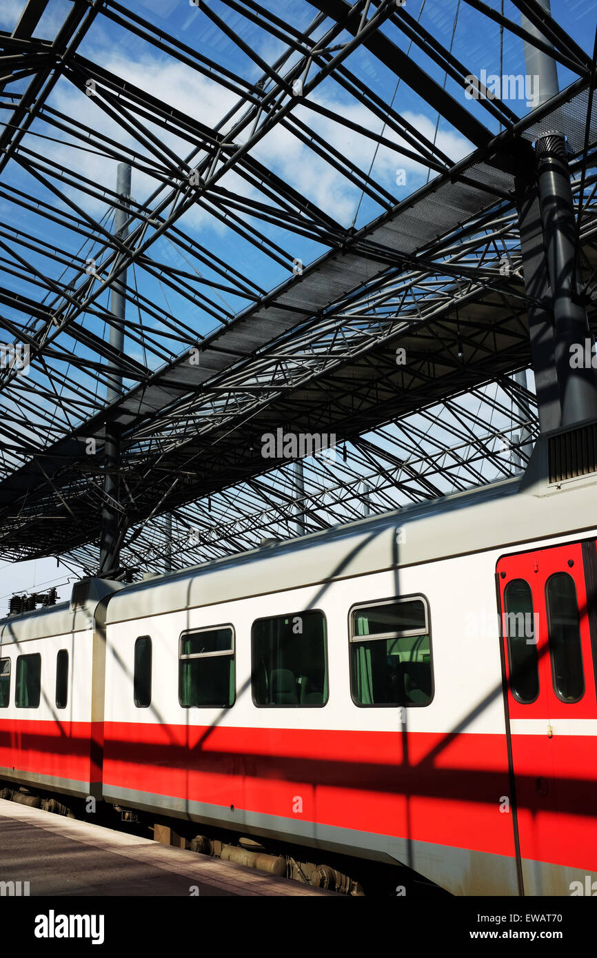 carriages of a passenger train under a glass roof station Stock Photo ...