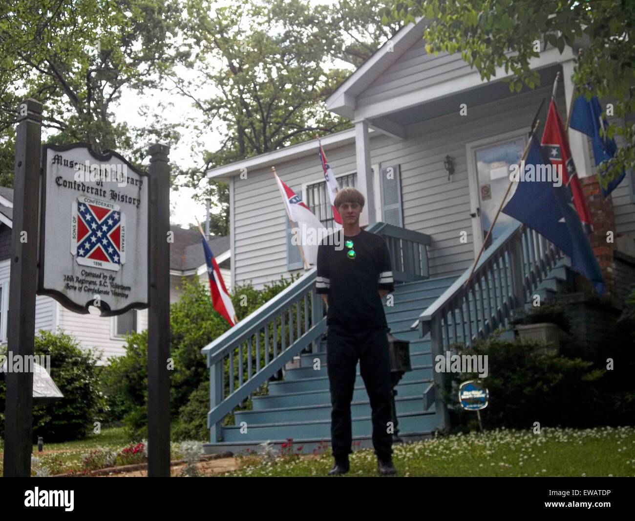 Charleston, South Carolina, USA. 21st June, 2015. A photo from a white supremacist website showing Dylann Storm Roof posing in front of the Museum and Library of Confederate History April 24, 2015 in Greenville, South Carolina. Roof murdered nine members of the Emanuel African Methodist Episcopal Church in a racially motivated killing on June 17, 2015 in Charleston, S.C. Credit:  Planetpix/Alamy Live News Stock Photo