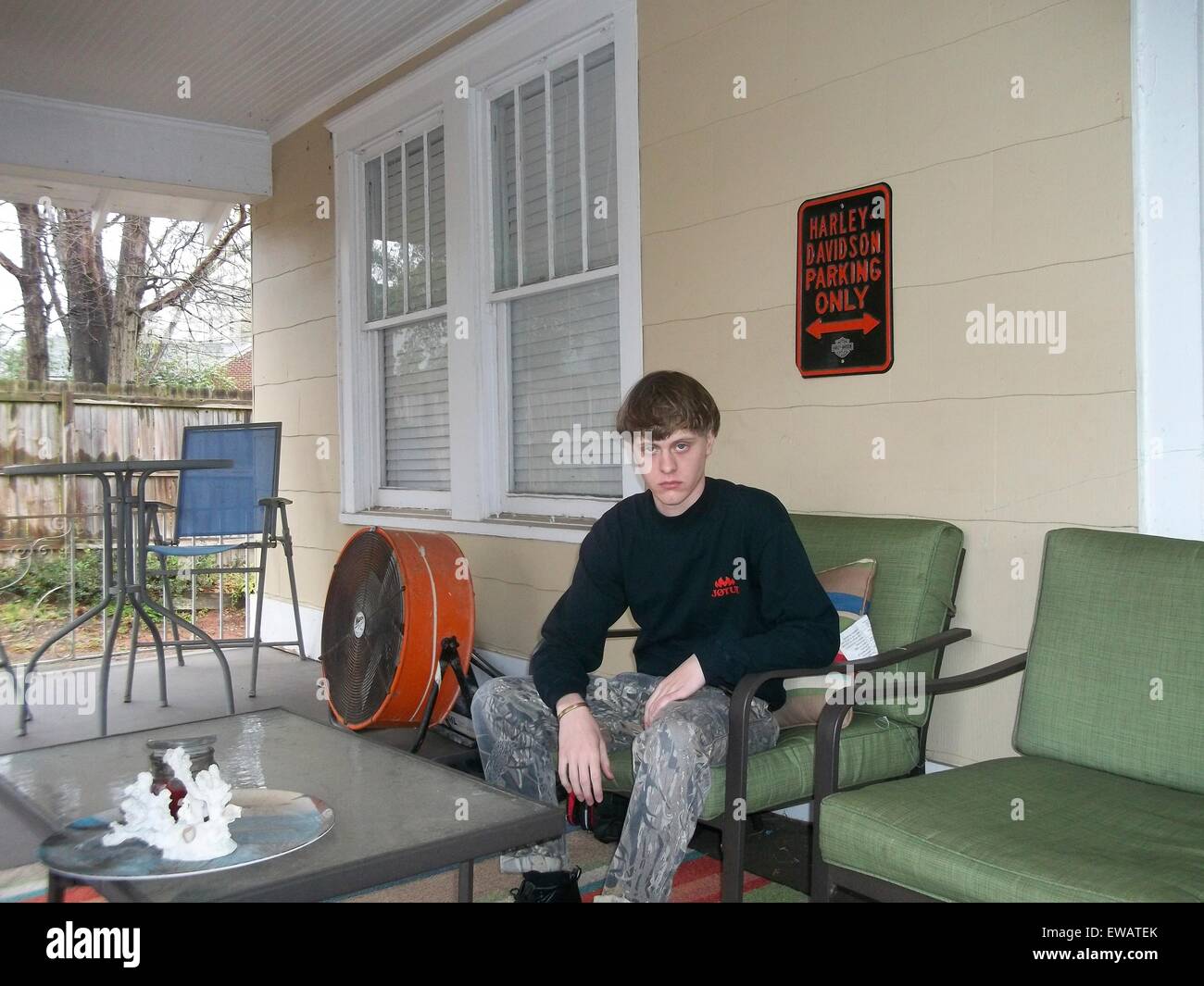 A photo from a white supremacist website showing Dylann Storm Roof posing on a porch March 19, 2015. Roof murdered nine members of the Emanuel African Methodist Episcopal Church in a racially motivated killing on June 17, 2015 in Charleston, S.C. Credit:  Planetpix/Alamy Live News Stock Photo