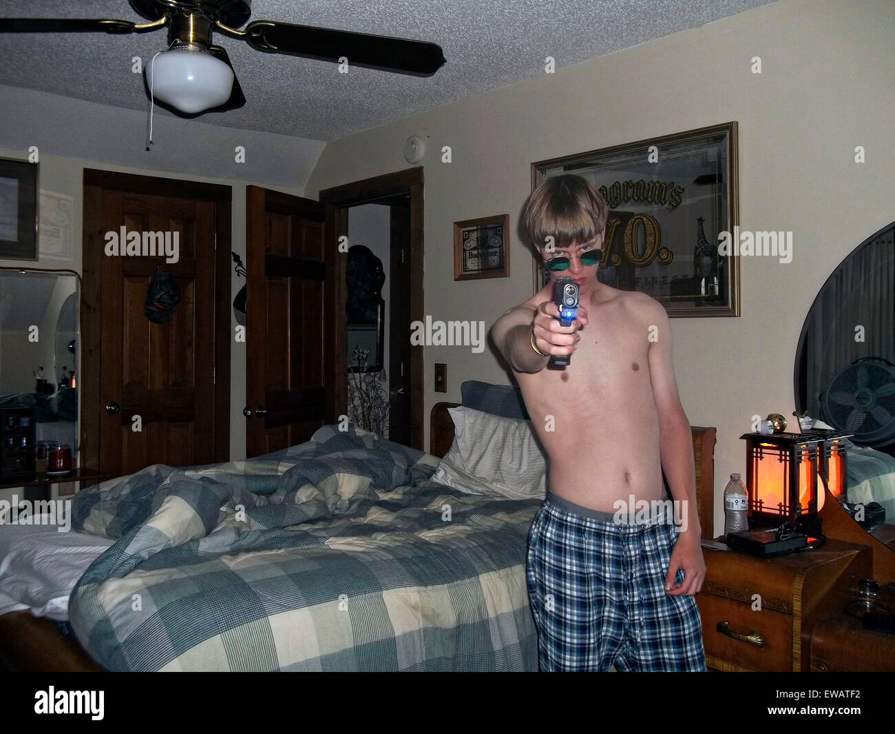 Charleston, South Carolina, USA. 21st June, 2015. A photo from a white supremacist website showing Dylann Storm Roof with a handgun in a bedroom April 20, 2015. Roof murdered nine members of the Emanuel African Methodist Episcopal Church in a racially motivated killing on June 17, 2015 in Charleston, S.C. Credit:  Planetpix/Alamy Live News Stock Photo