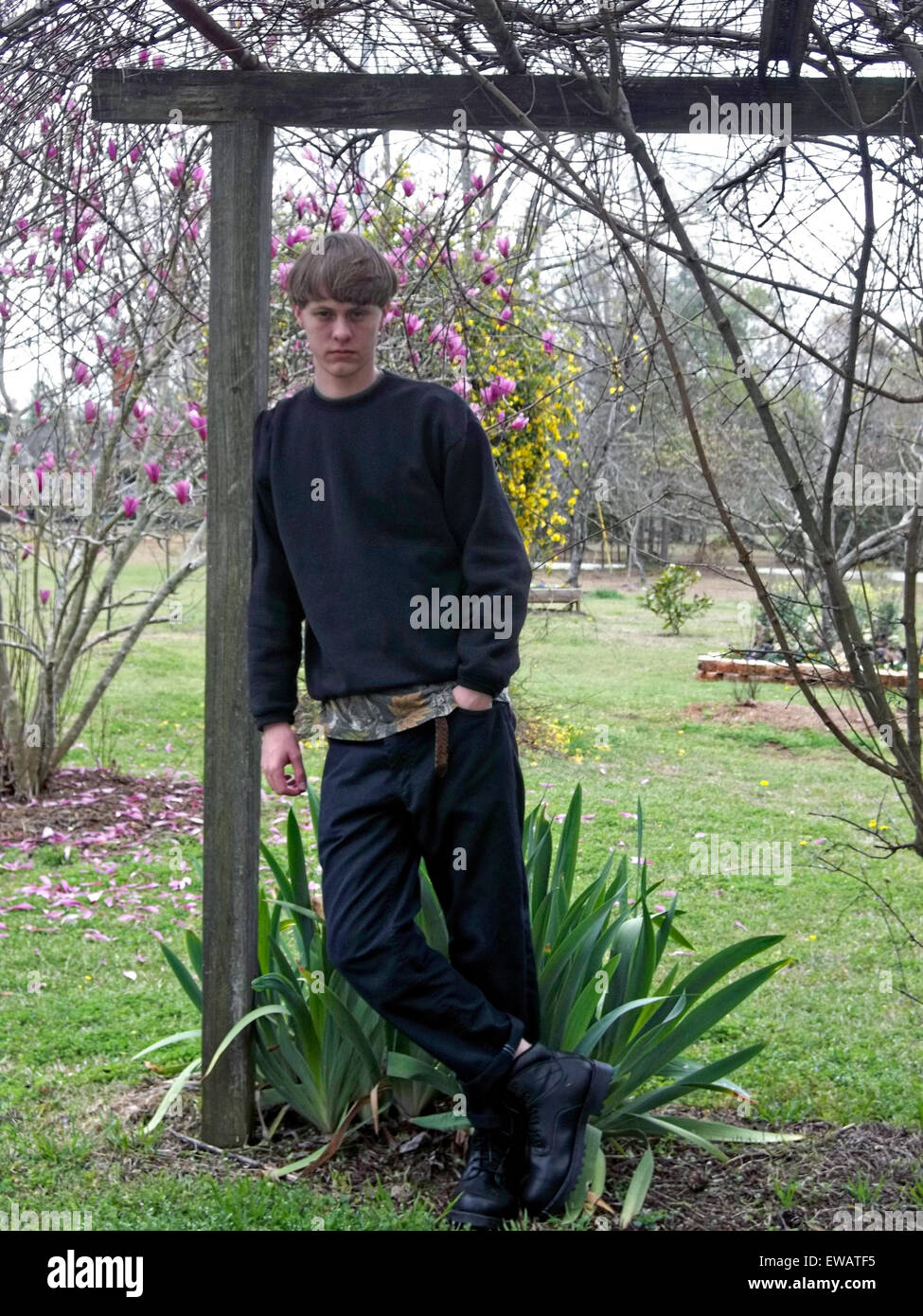 A photo from a white supremacist website showing mass murderer Dylann Storm Roof posing in a garden March 23, 2015. Roof murdered nine members of the Emanuel African Methodist Episcopal Church in a racially motivated killing June 17, 2015 in Charleston, S.C. Credit:  Planetpix/Alamy Live News Stock Photo