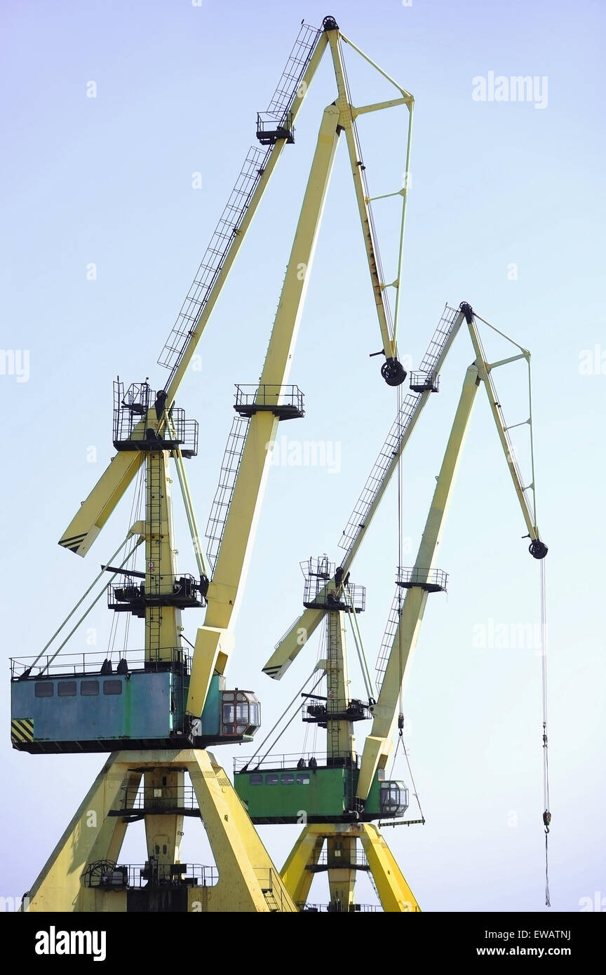 Industrial shipping cranes for containers in a harbor Stock Photo