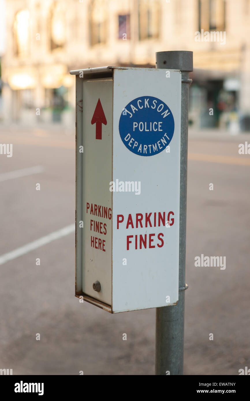 A pole-mounted box awaits payment of parking fines in Jackson, Tennessee. Stock Photo
