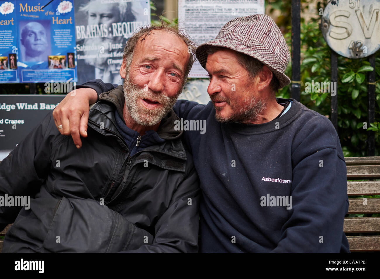 Two homeless men sitting on a bench Stock Photo Alamy