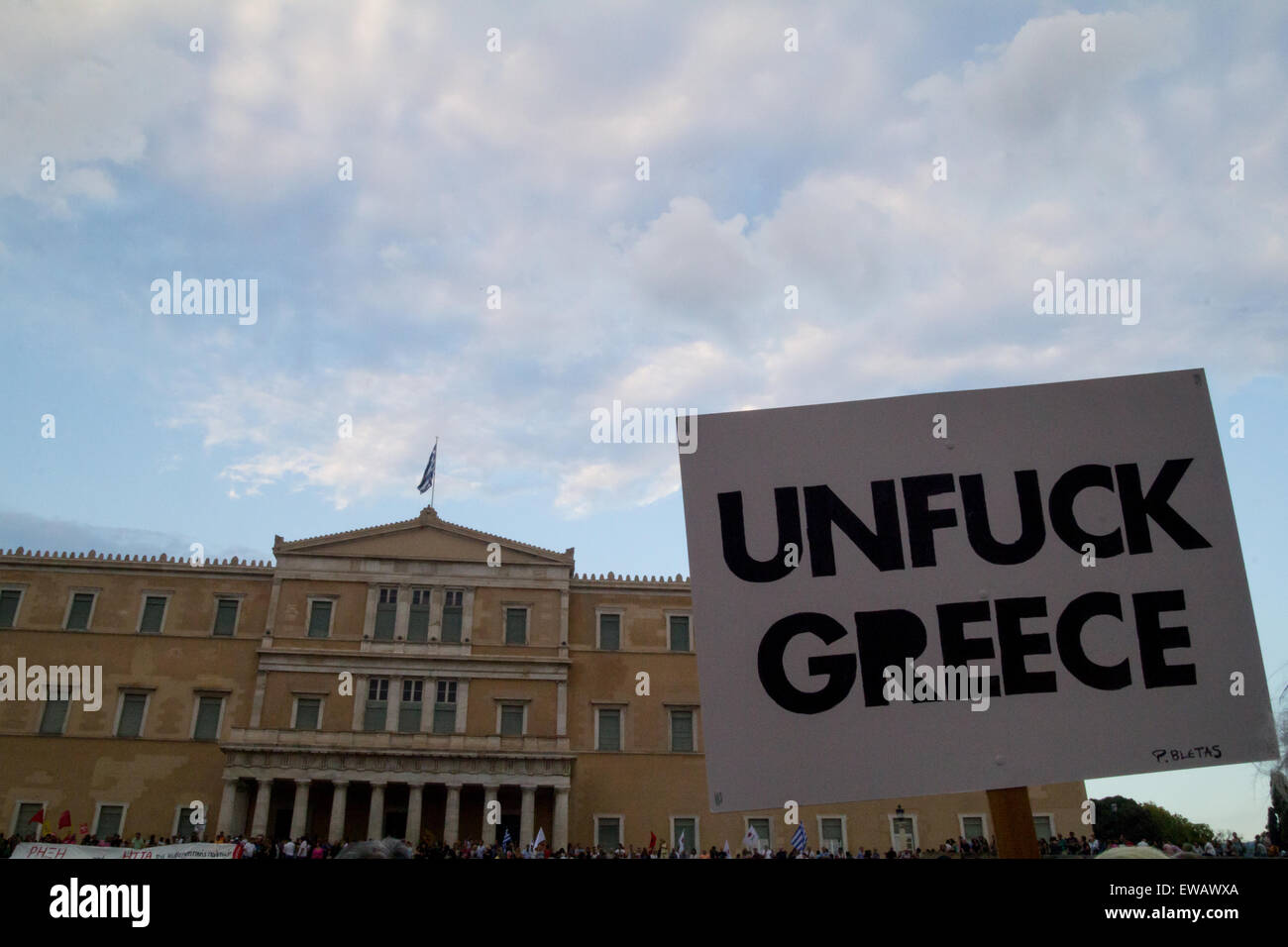 Athens, Greece. 21st June, 2015. A placard with the slogan 'Unfuck Greece' is seen during the demonstration. Greeks demonstrate against austerity prior to Monday's 22nd July Eurogroup which is possible to decide if Greece remains or exits Eurozone. Credit:  Kostas Pikoulas/Pacific Press/Alamy Live News Stock Photo