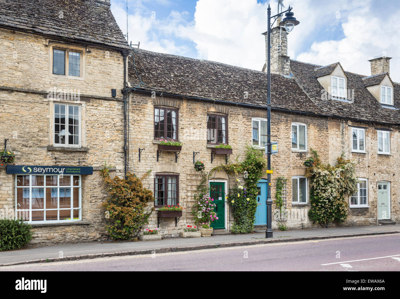 Pretty Traditional Cotswold Stone Terraced Buildings In Tetbury, A 