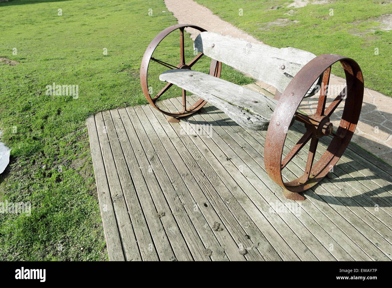 Unique park bench made from iron bullock cart wheels Stock Photo