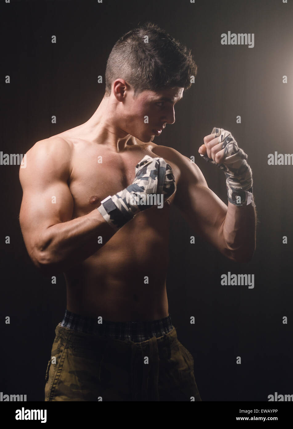 Boxer man on guard in a studio shot Stock Photo