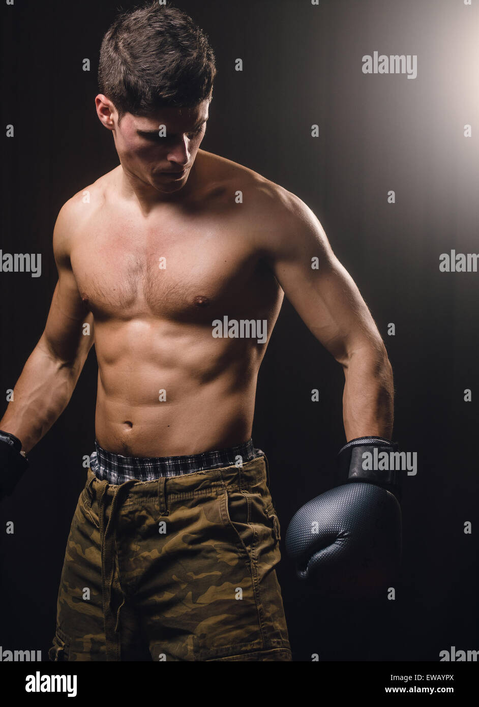 Boxer man posing in a studio shot Stock Photo