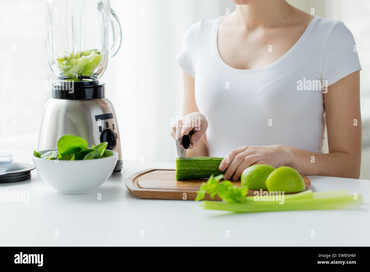 Close Up Of Woman With Blender Chopping Vegetables Stock Photo Alamy