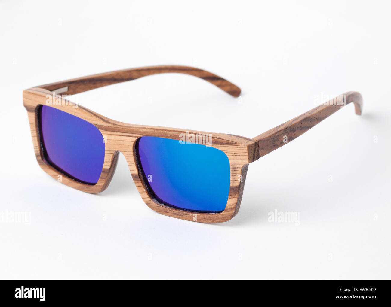 Wooden sunglasses isolated on white background in a studio shot. Stock Photo