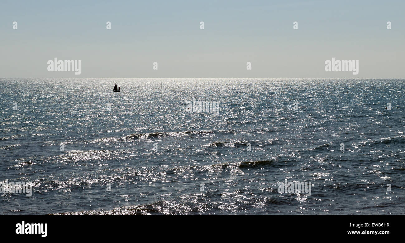 Lone yacht in an empty seascape. Stock Photo