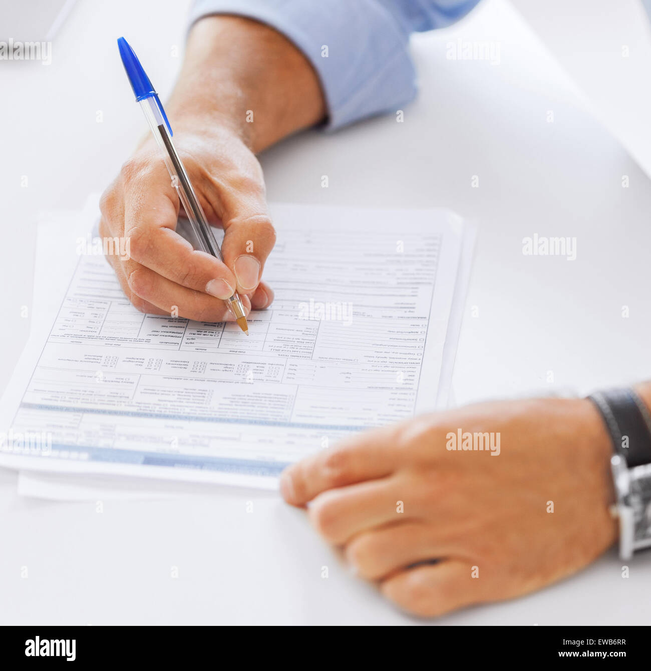 man filling tax form Stock Photo - Alamy