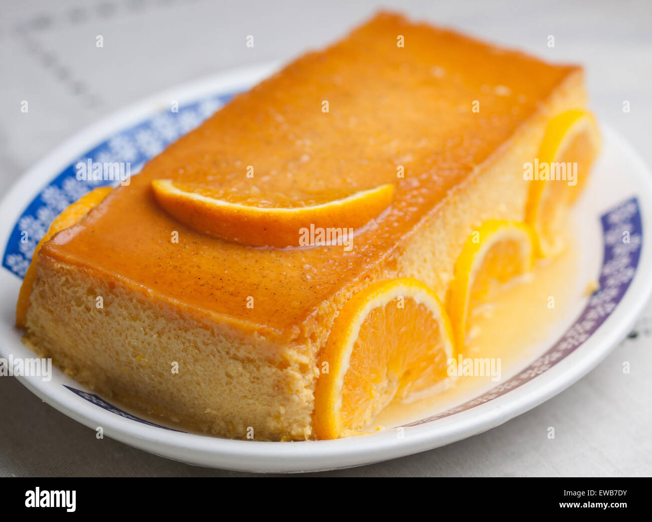 Orange custard in a studio shot. A delicious dessert. Stock Photo