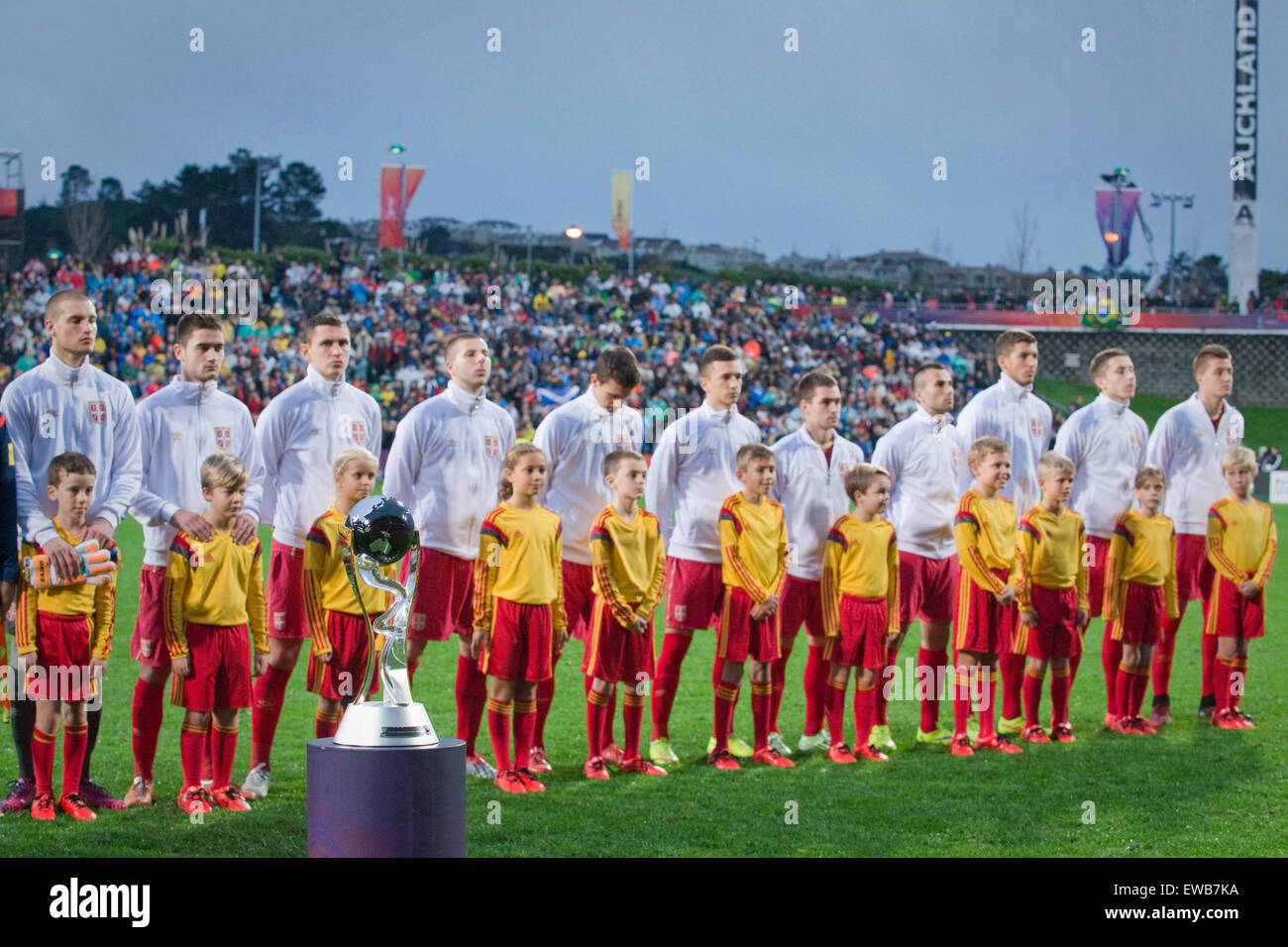 Auckland, New Zealand, Feature. 20th June, 2015. Auckland, New Zealand - June 20, 2015 - The FIFA U20 World Cup Trophy is displayed with Team Serbia in the background ahead of the FIFA U20 World Cup final match between Brazil and Serbia at North Harbour Stadium on June 20, 2015 in Auckland, New Zealand, Feature. Credit:  dpa/Alamy Live News Stock Photo
