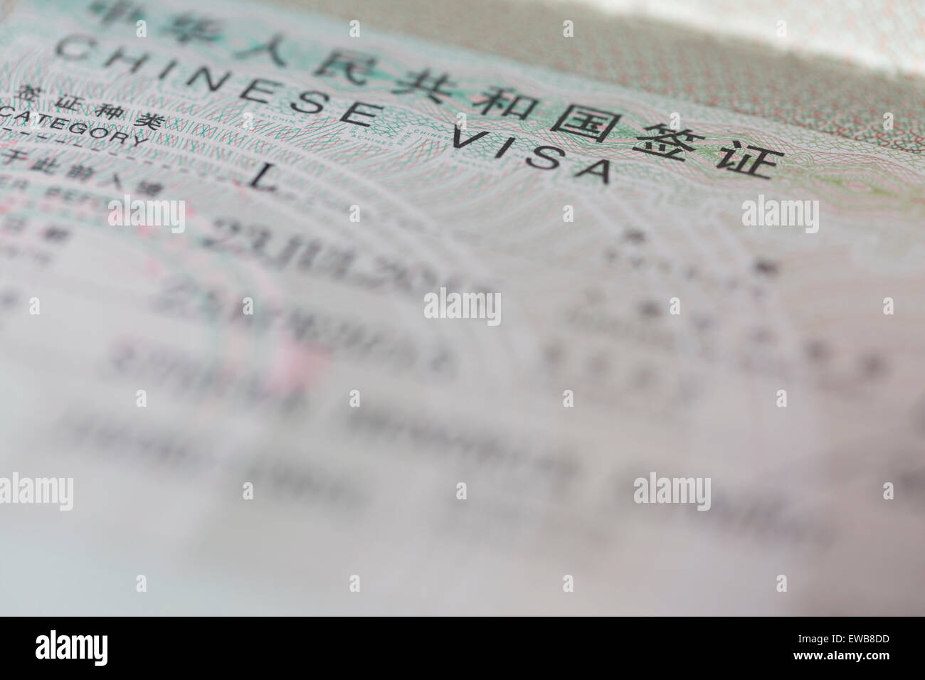 Close up view of a Chinise Visa for Tourist in a Passport Stock Photo