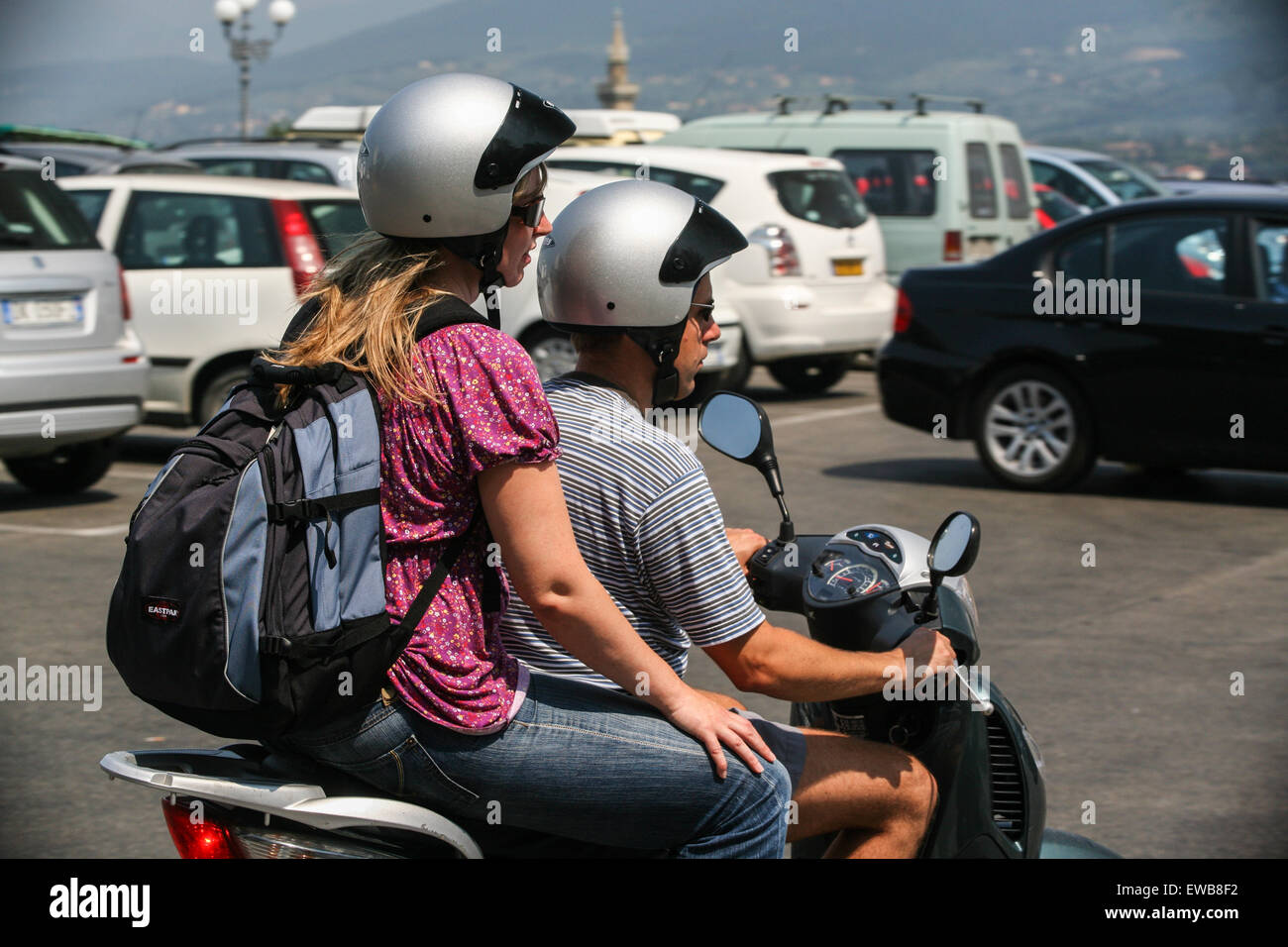 Couple on scooter on large square Piazzale Michelangelo overlooking Firenze/ Florence city in Tuscany. Italy. June.  © Paul Quay Stock Photo