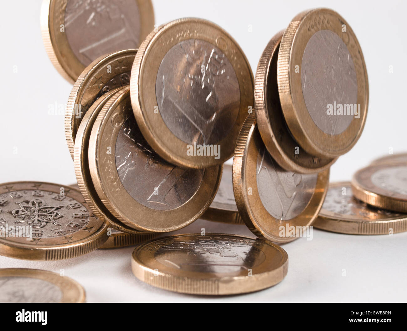 Euro coins falling isolated on white background Stock Photo - Alamy
