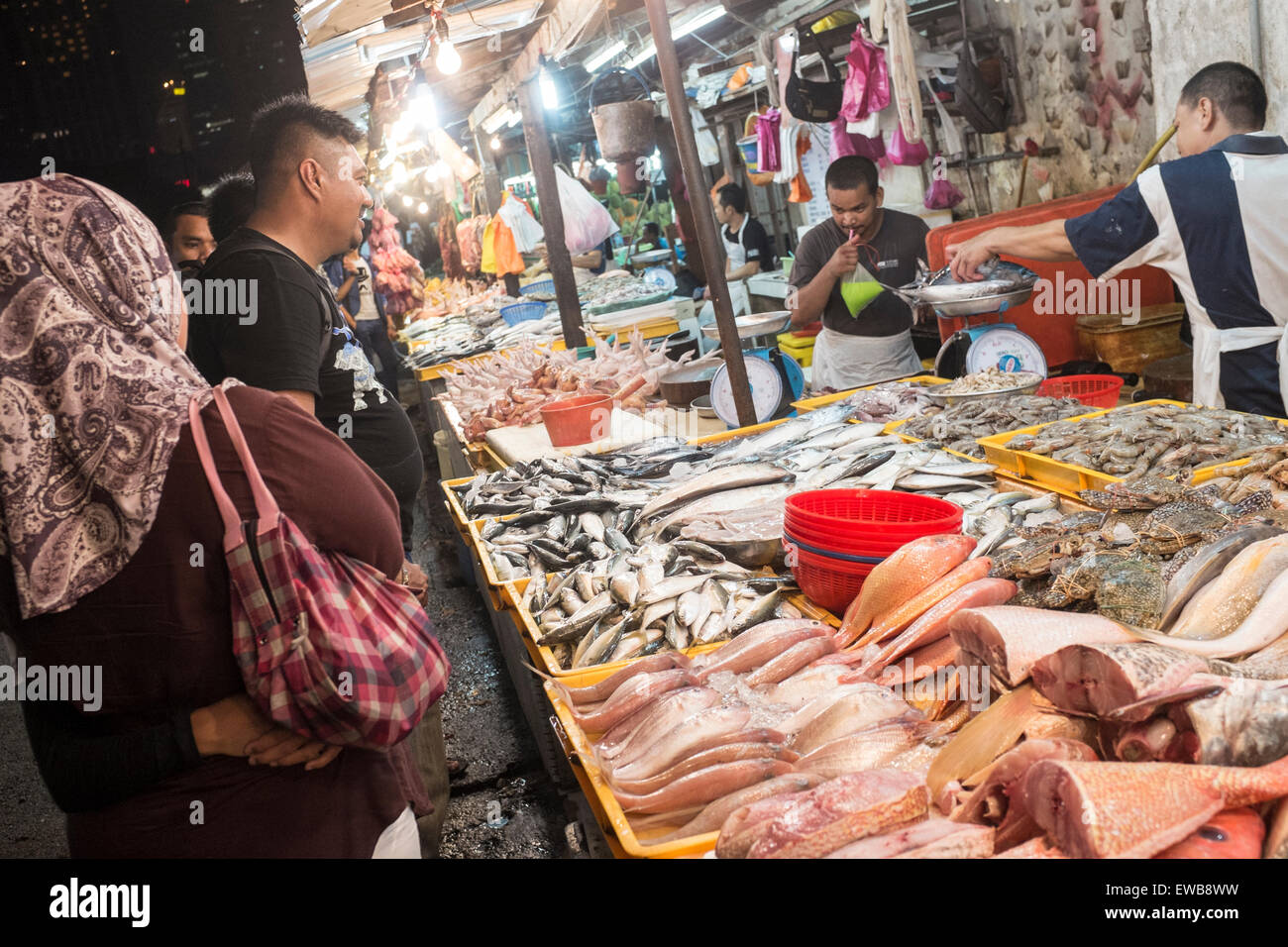 A fishmonger at Chow Kit night market in Kuala Lumpur, Malaysia Stock Photo