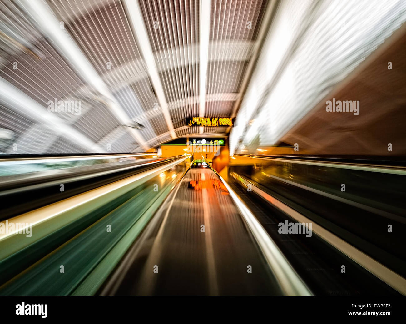 Moving stairs in an airport with different colors Stock Photo - Alamy