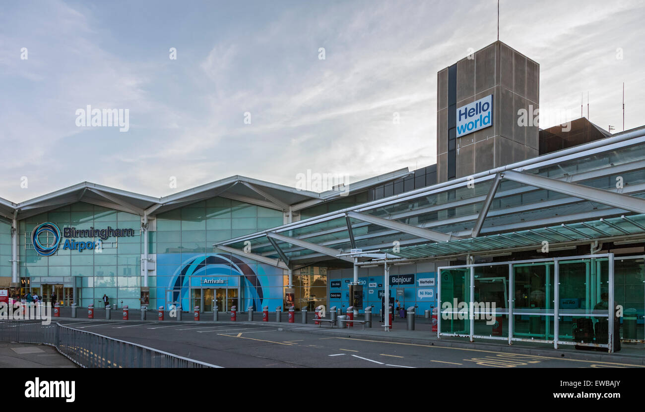 Exterior of Birmingham Airport, England. Entrance to the Arrival Lounge,Hello World branding on a tower. Incidental passengers. Stock Photo