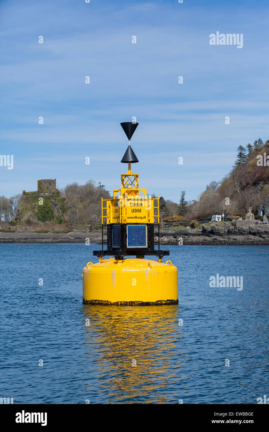 Corran Ledge buoy, west cardinal marker with Dunollie Castle Stock Photo