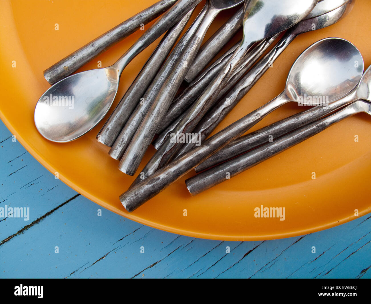 Silver spoons on plate Stock Photo