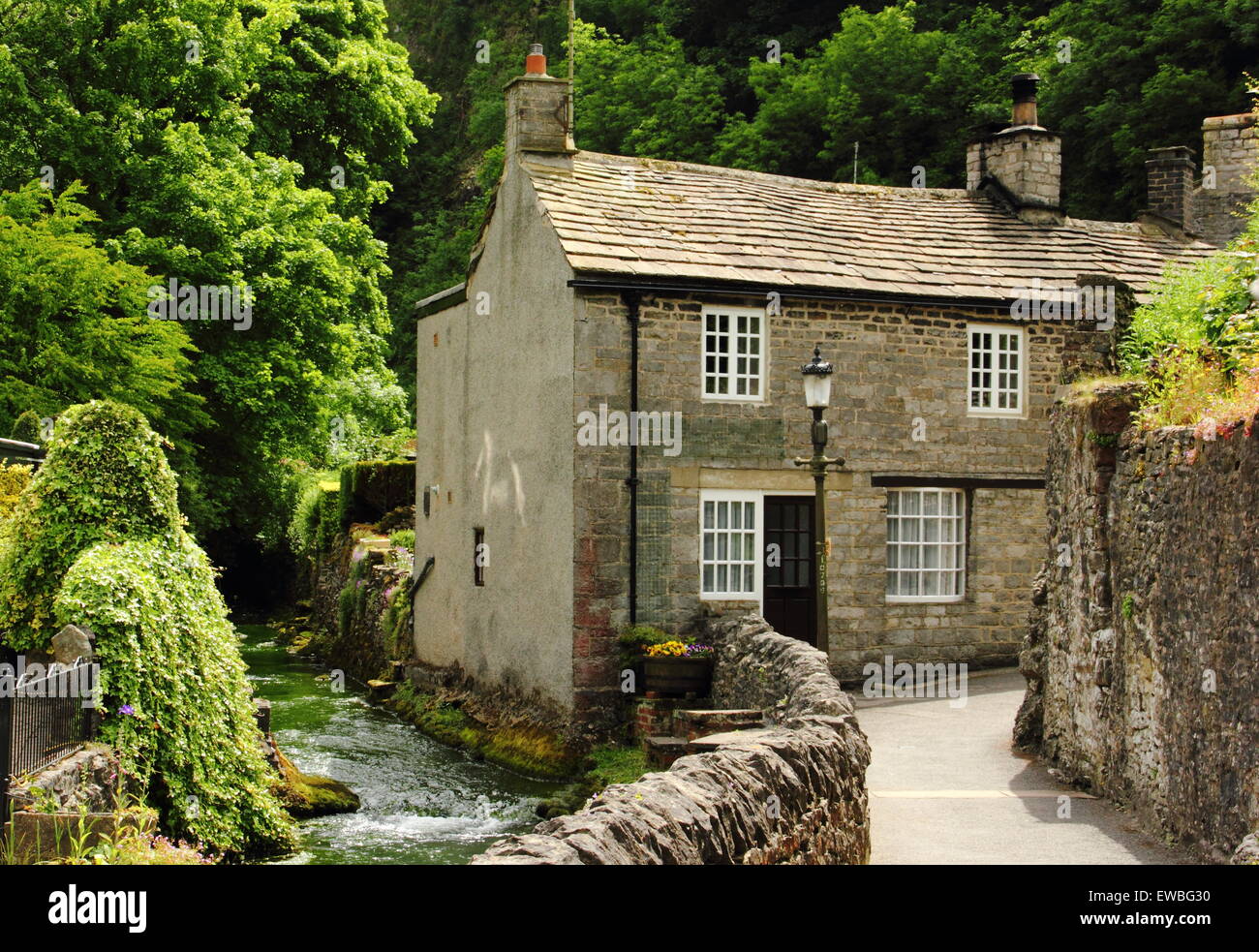 Stone built cottages by Peakshole Water in the heart of Castleton