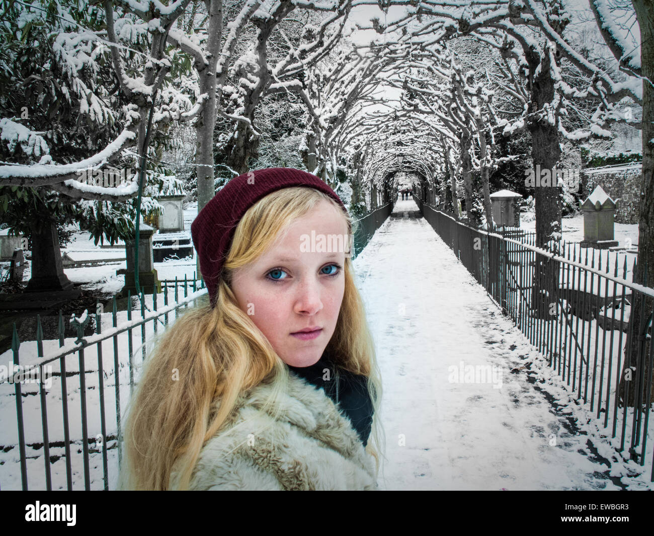 Girl at entrance to 'Birdcage walk' in Clifton, Bristol, on cold winters day Stock Photo