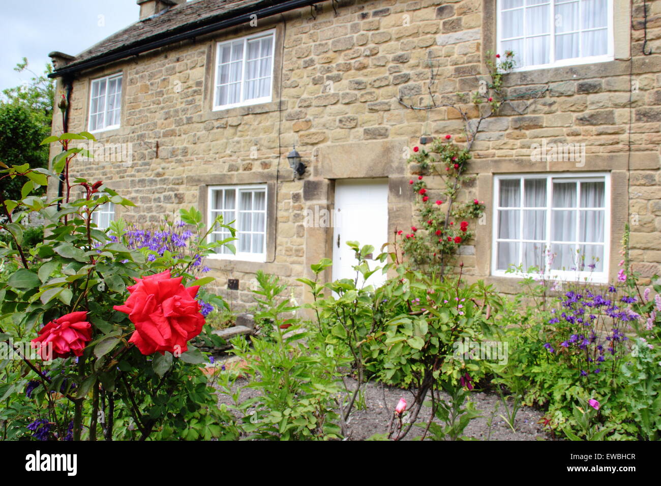 A 'plague cottage' on the main street at Eyam village in the Peak District NP, Derbyshire UK Stock Photo