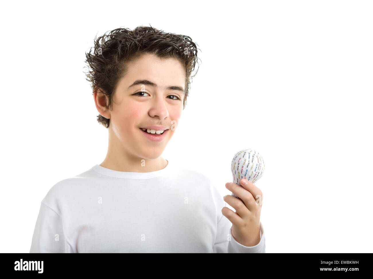 Happy Caucasian smooth-skinned boy in white long sleeved t-shirt smiles holding 3D printed lightbulb with left hand Stock Photo