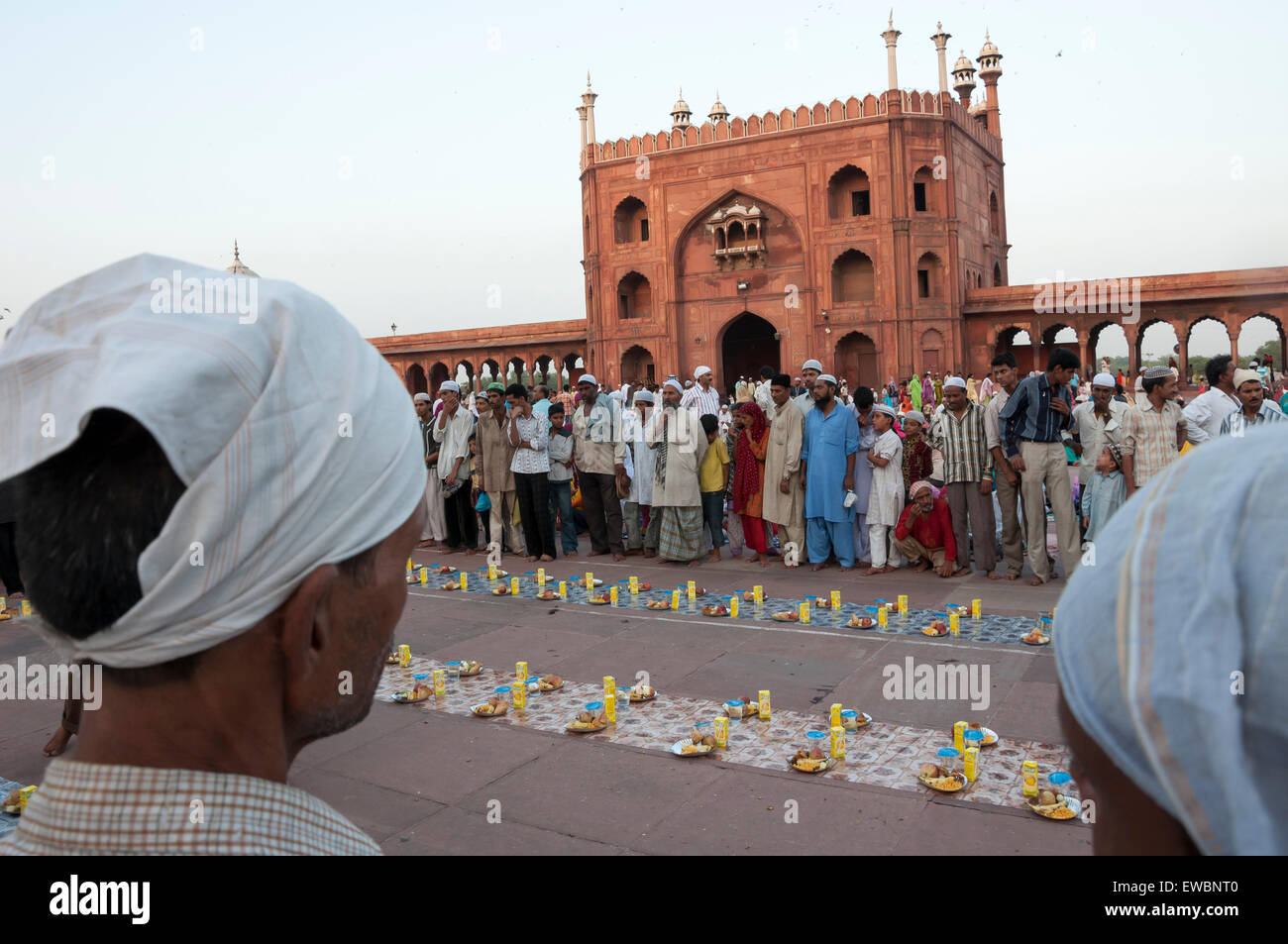 People waiting for the traditional Iftar (fast-breaking) at Jama Masjid during Ramadan. Old Delhi, India. Stock Photo