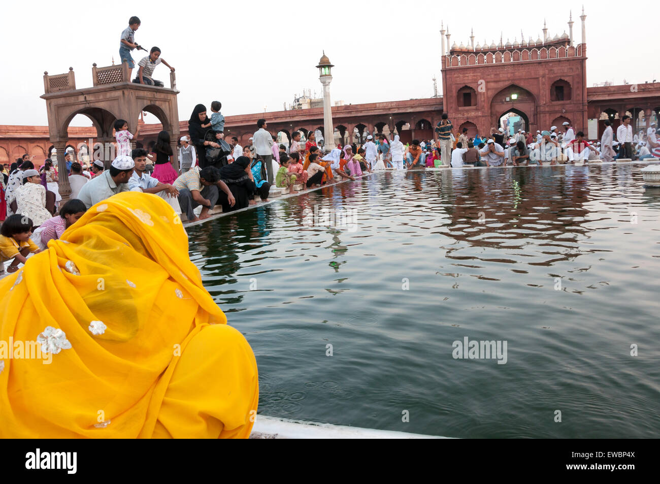 People at the ablution pond in Jama Masjid during Ramadan. Old Delhi, India Stock Photo
