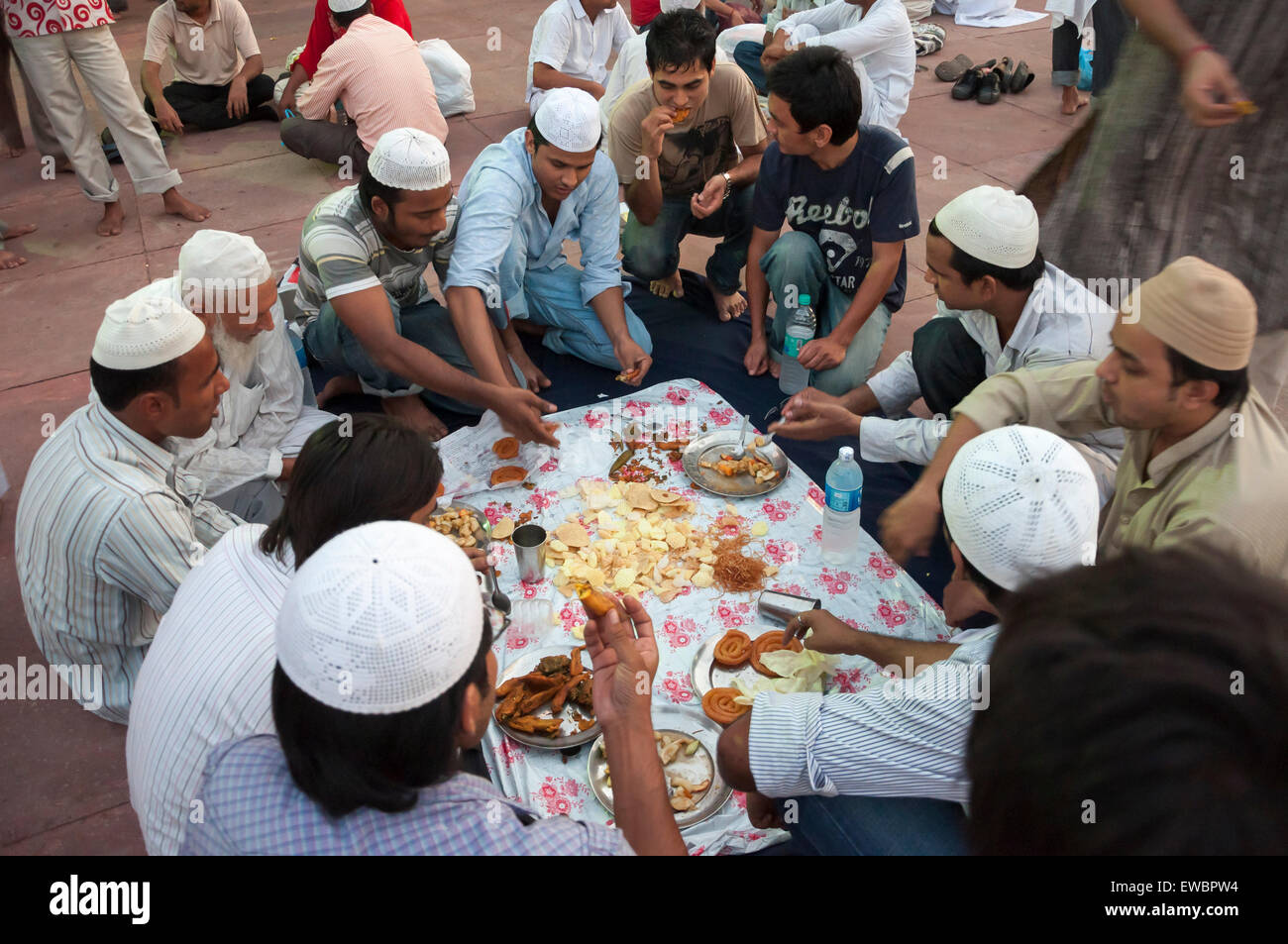 Traditional Iftar (fast-breaking) at Jama Masjid during Ramadan. Old Delhi, India. Stock Photo