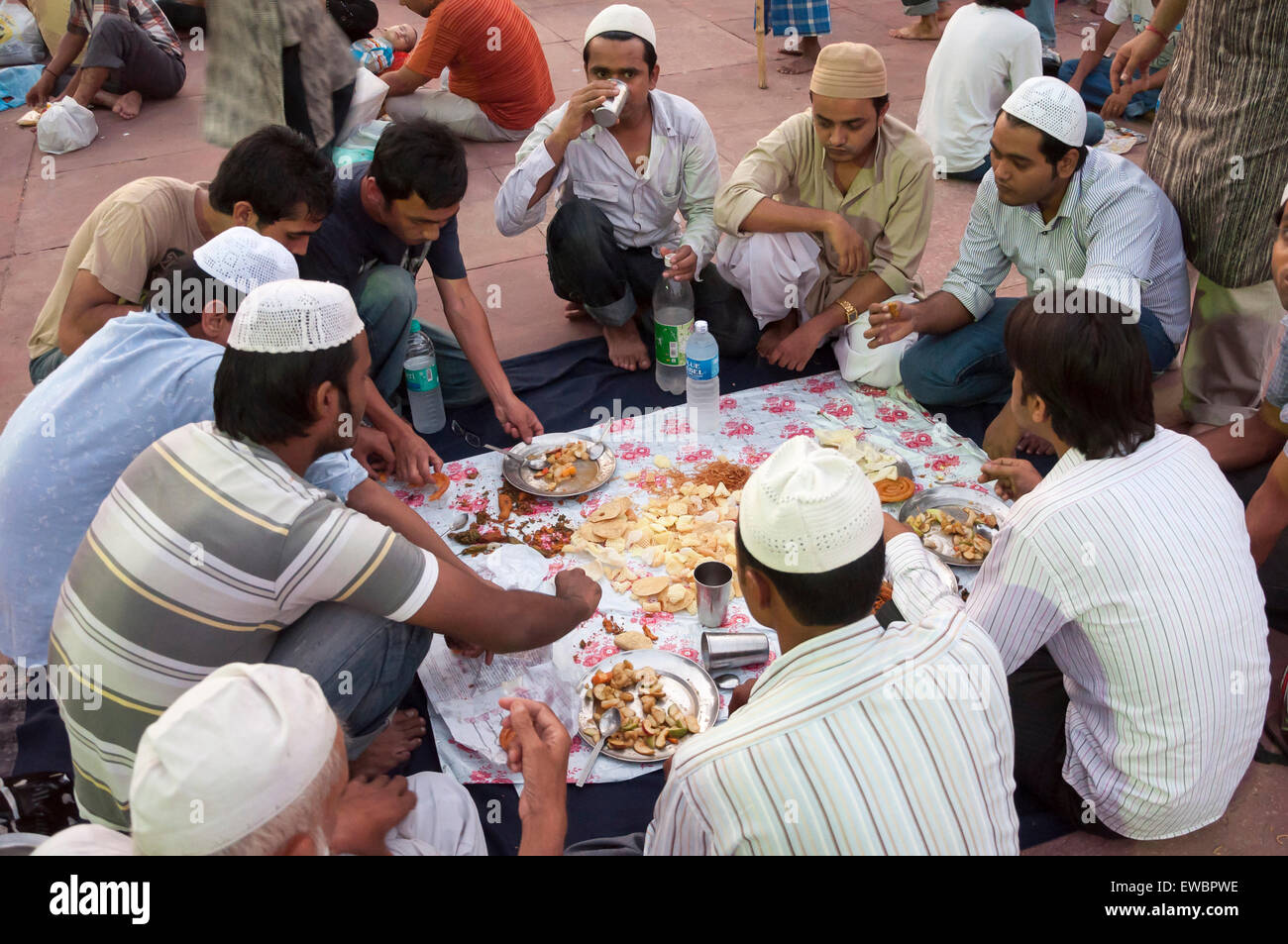 Traditional Iftar (fast-breaking) at Jama Masjid during Ramadan. Old Delhi, India. Stock Photo