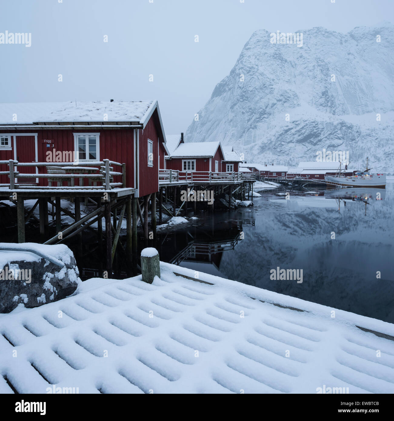 Traditional red Rorbu cabins in winter, Reine, Moskenesøy, Lofoten Islands, Norway Stock Photo
