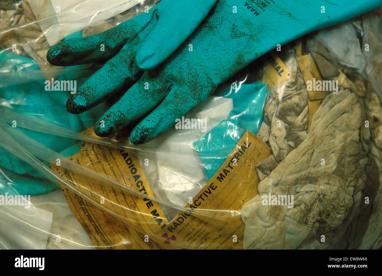 Dirty rubber gloves laying on radioactive waste, New Mexico, USA Stock