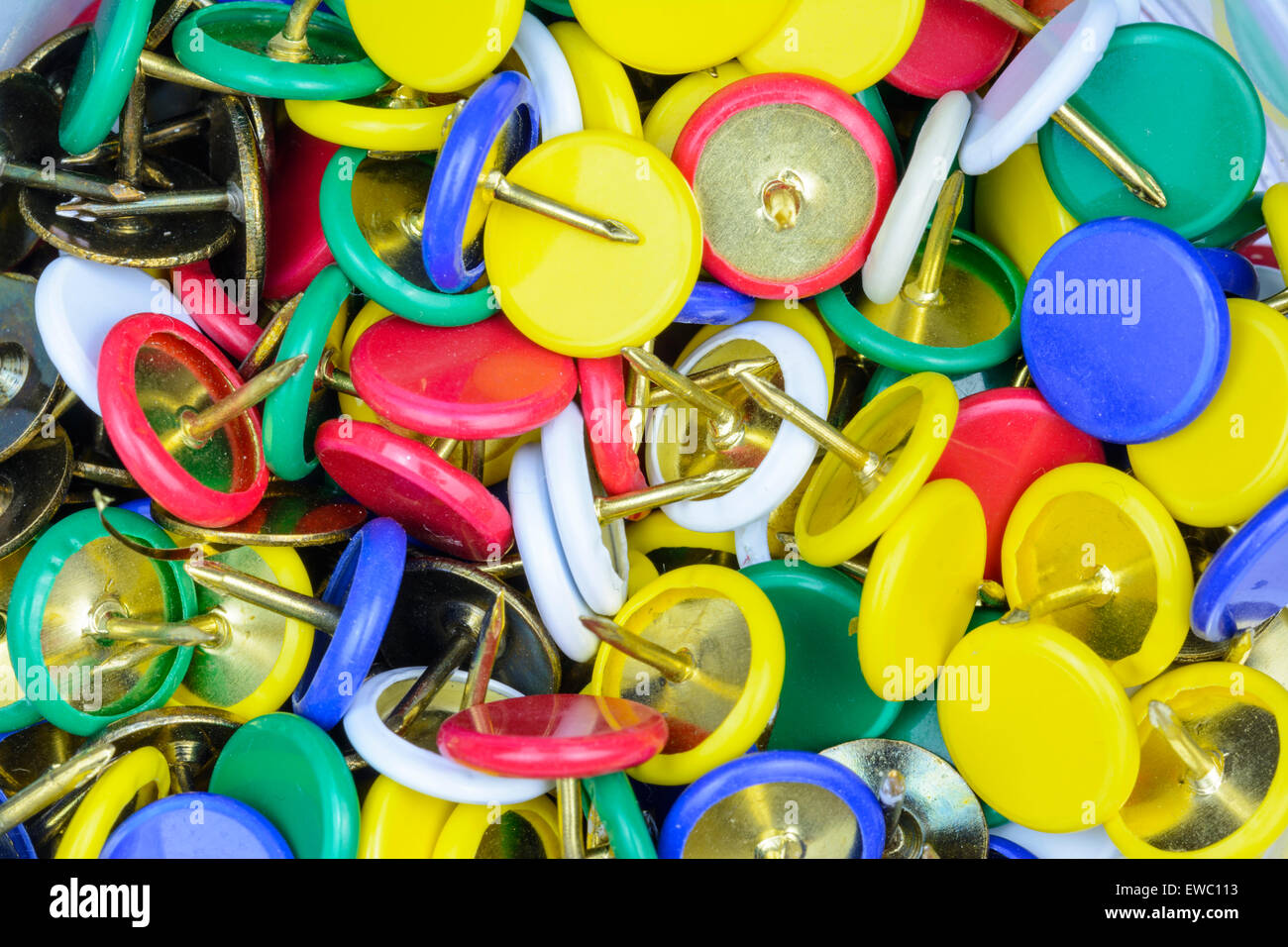 Pile of multicoloured drawing pins (thumb tacks). Stock Photo