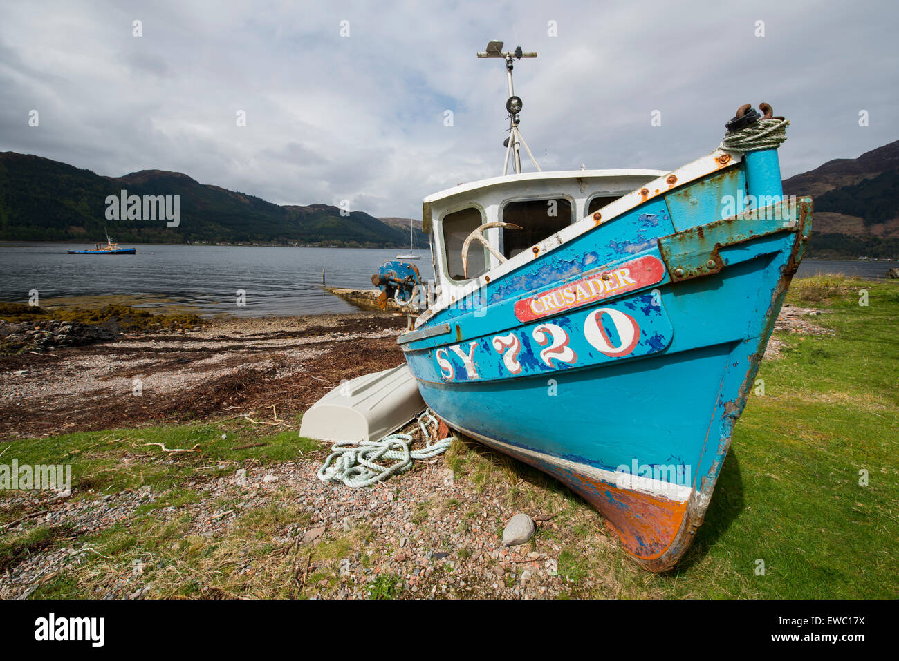 Ship at the shorte on loch Duich in the Highlands of Scotland with lake, image Daan Kloeg, Commee Stock Photo