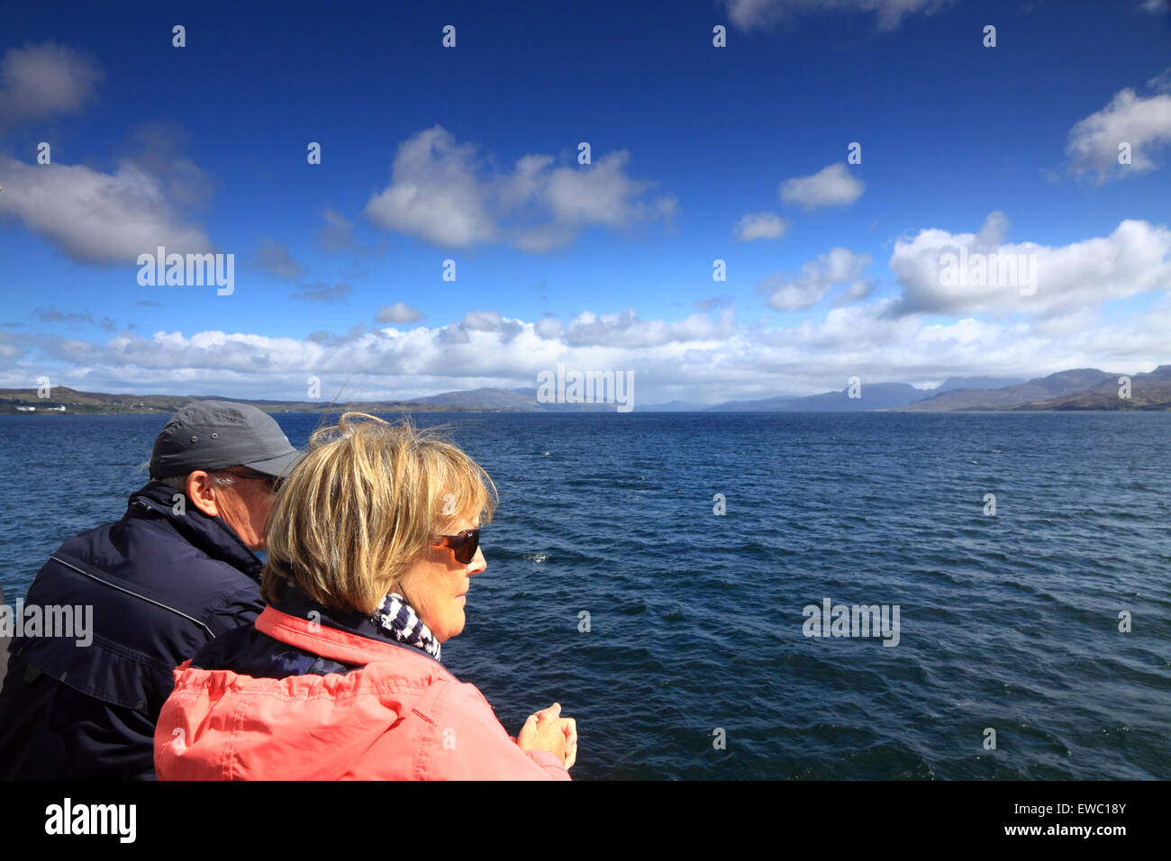 Middle-aged couple taking in the view of the Sound of Sleat, on the Mallaig - Armadale ferry, Scotland Stock Photo