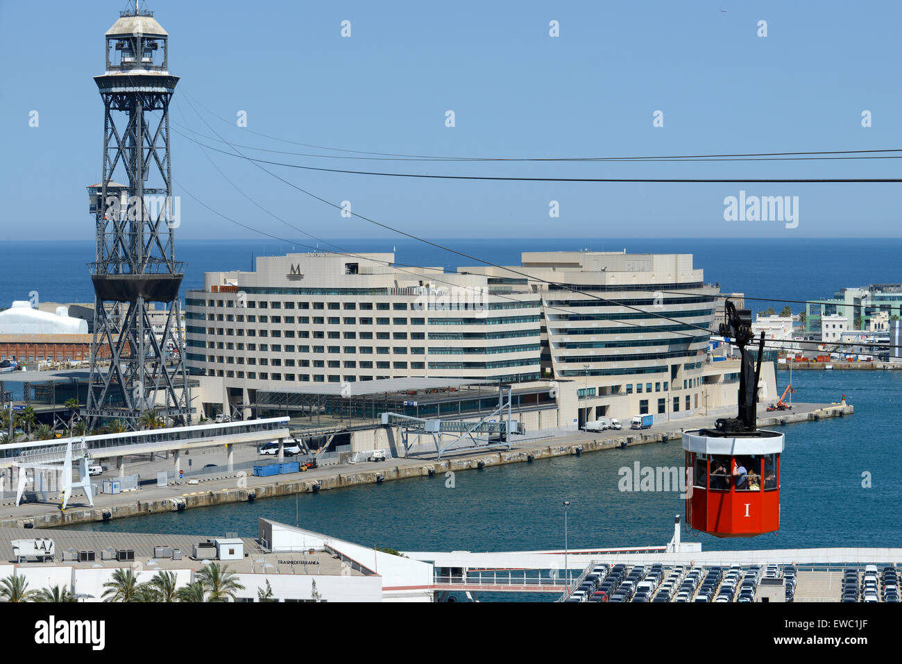 The Romantic route in Barcelona. Monjuic mountain. View of Barcelona Harbour. The red Teleferic cable car running across Barcelona Port in Barcelona Spain It runs from the beach in Barceloneta to Mountjuic. Montjuic Cable Car Above Harbour, Barcelona. Stock Photo