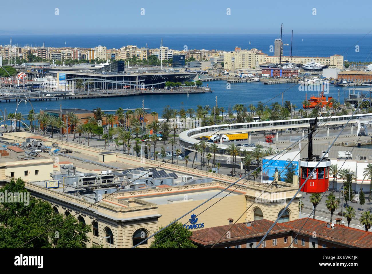 The Romantic route in Barcelona. Monjuic mountain. View of Barcelona Harbour. The red Teleferic cable car running across Barcelona Port in Barcelona Spain It runs from the beach in Barceloneta to Mountjuic. Montjuic Cable Car Above Harbour, Barcelona. Stock Photo