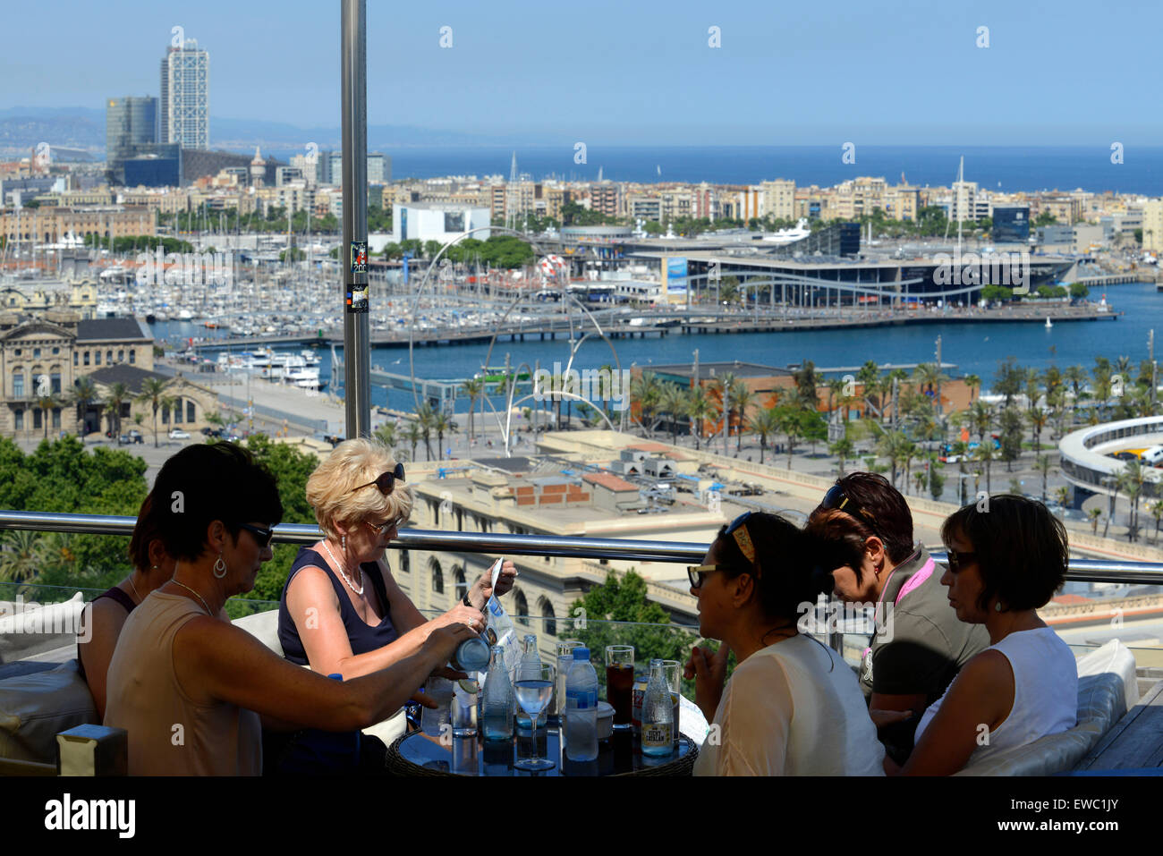 The Romantic route in Barcelona. Monjuic mountain. View of Barcelona Harbour. Above Harbour, Barcelona. People dinning in the Miramar gourmet restaurant. Stock Photo